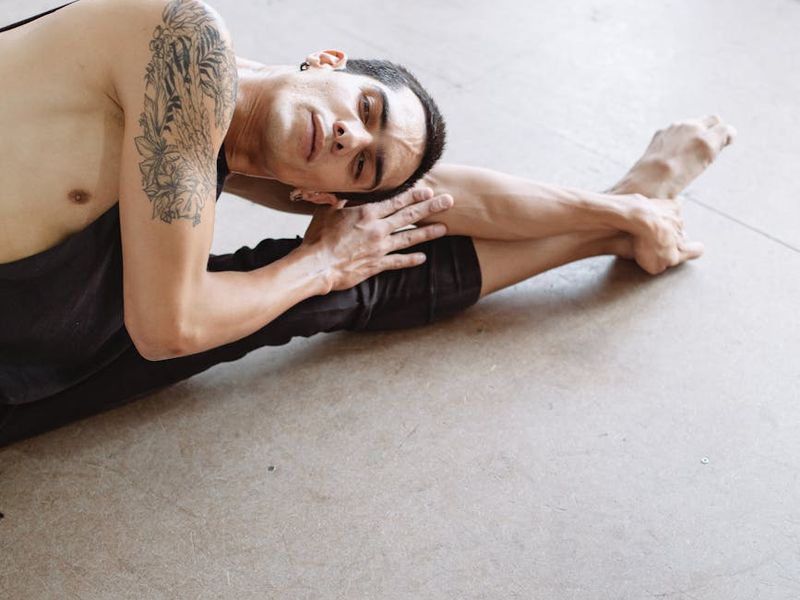 Man in a focused stance, mid-exercise, showing control and balance.